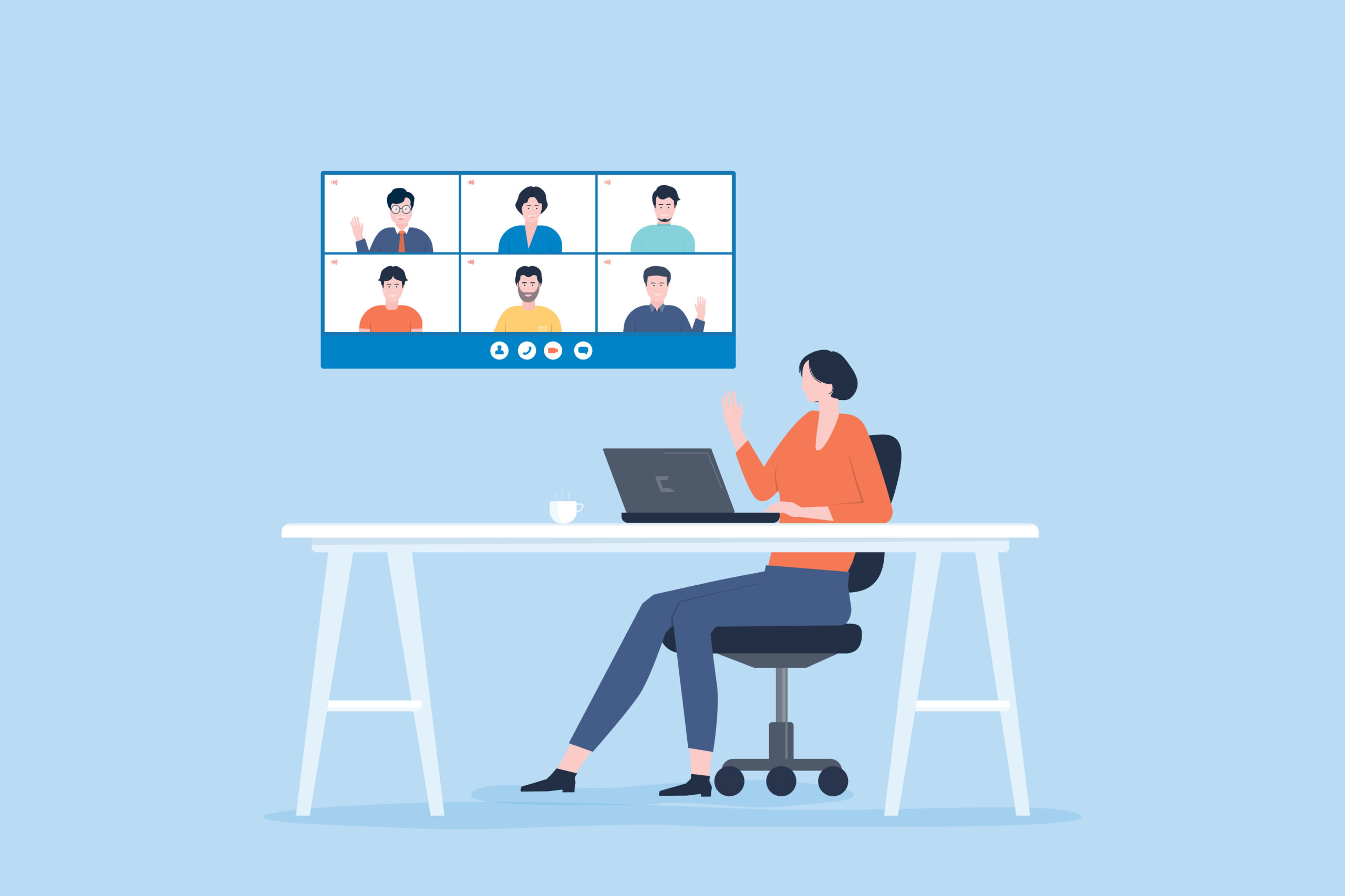 Person sitting at desk on their laptop and participating in a video meeting